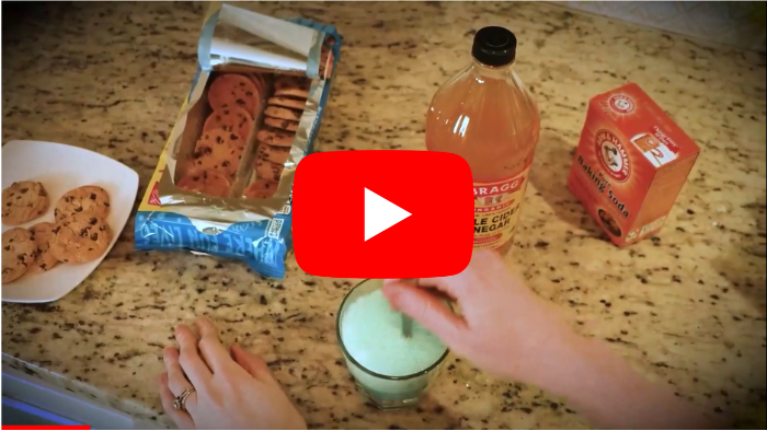 Image depicting a person struggling with weight loss or fat accumulation, looking contemplative and concerned, with a subtle visual highlight on a small transparent apple cider vinegar bottle circled inside the image to symbolize the unique mechanism of the 10-second ritual combined with apple cider vinegar for fat loss acceleration, no text or logos, centered red YouTube style play button with white triangle, not too large, no special characters in the image